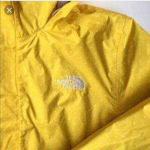 The north face yellow with whit polka dots parka